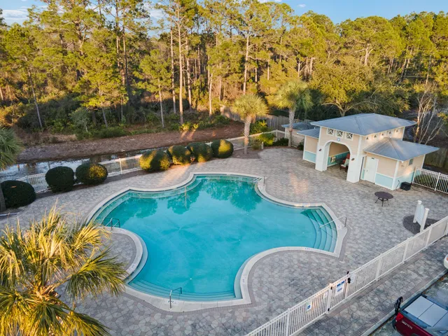 a view of a swimming pool with a patio