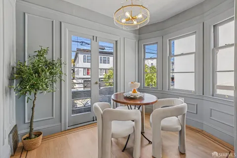 a dining room with furniture and window