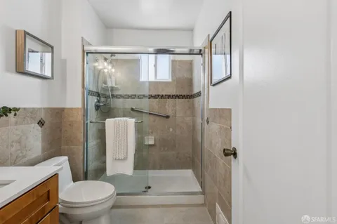 a bathroom with a shower and a toilet