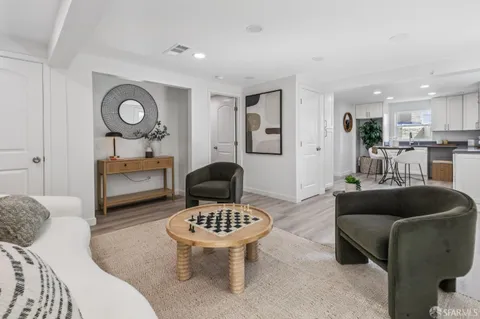 a living room with furniture and a rug