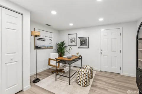 a room with furniture and a wooden floor