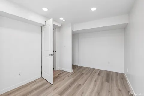 a bathroom with a sink vanity mirror and toilet