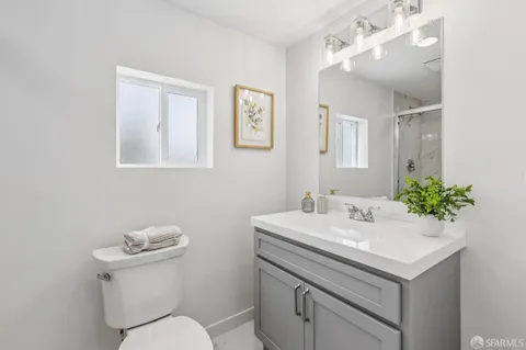 a bathroom with a shower and toilet