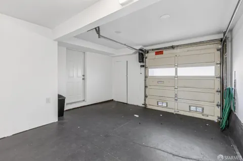 a view of an empty room with a hallway