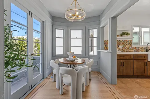 a dining room with furniture a livingroom and chandelier