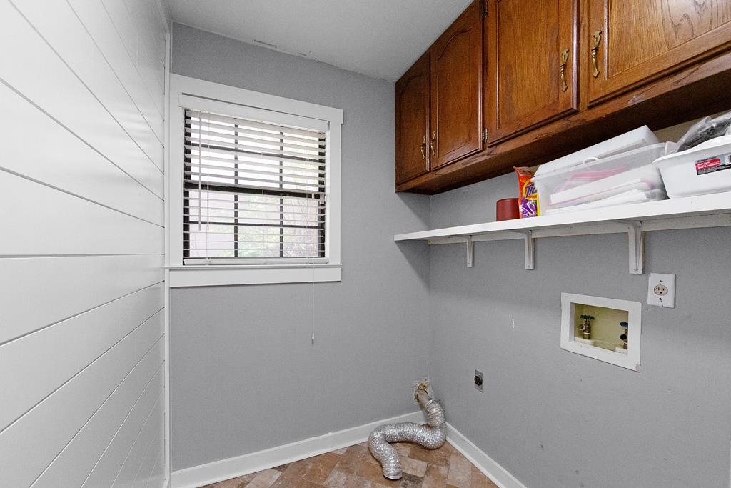 395 Park Hill Road Collierville, TN 38017 - Photo 6 of 22 Washer/Dryer hookups in the laundry room situated just off the garage. Shiplap has been added to the space for a modern touch!