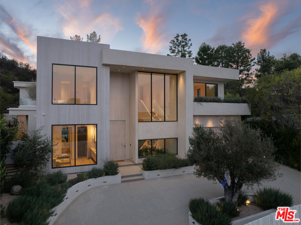 17177 Adlon Road Encino, CA 91436 - Photo 1 of 21 a front view of a house with a yard