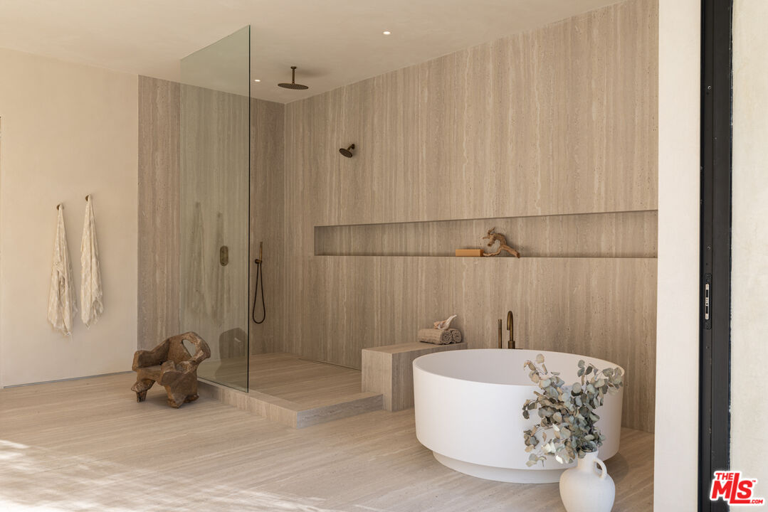 17177 Adlon Road Encino, CA 91436 - Photo 12 of 21 a bathroom with a bathtub and shower