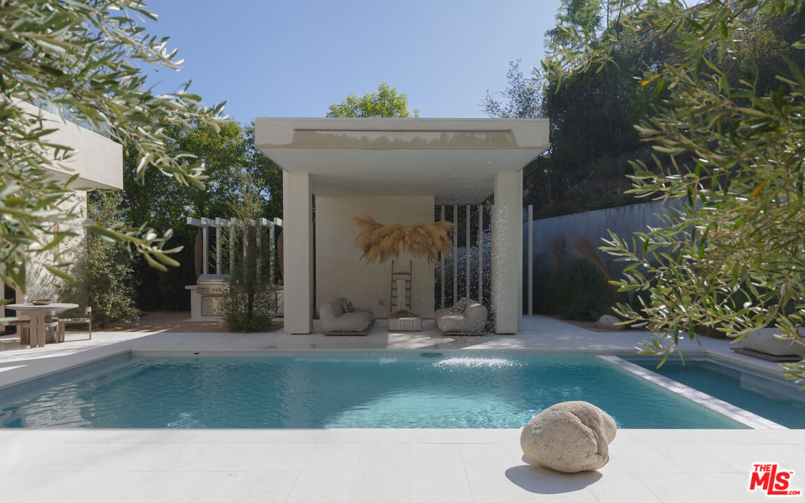 17177 Adlon Road Encino, CA 91436 - Photo 19 of 21 a view of a house with a yard