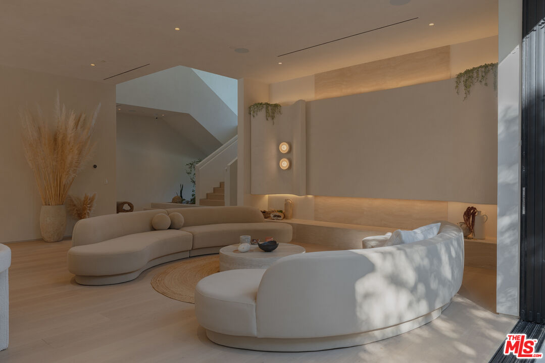 17177 Adlon Road Encino, CA 91436 - Photo 3 of 21 a living room with furniture and a fireplace