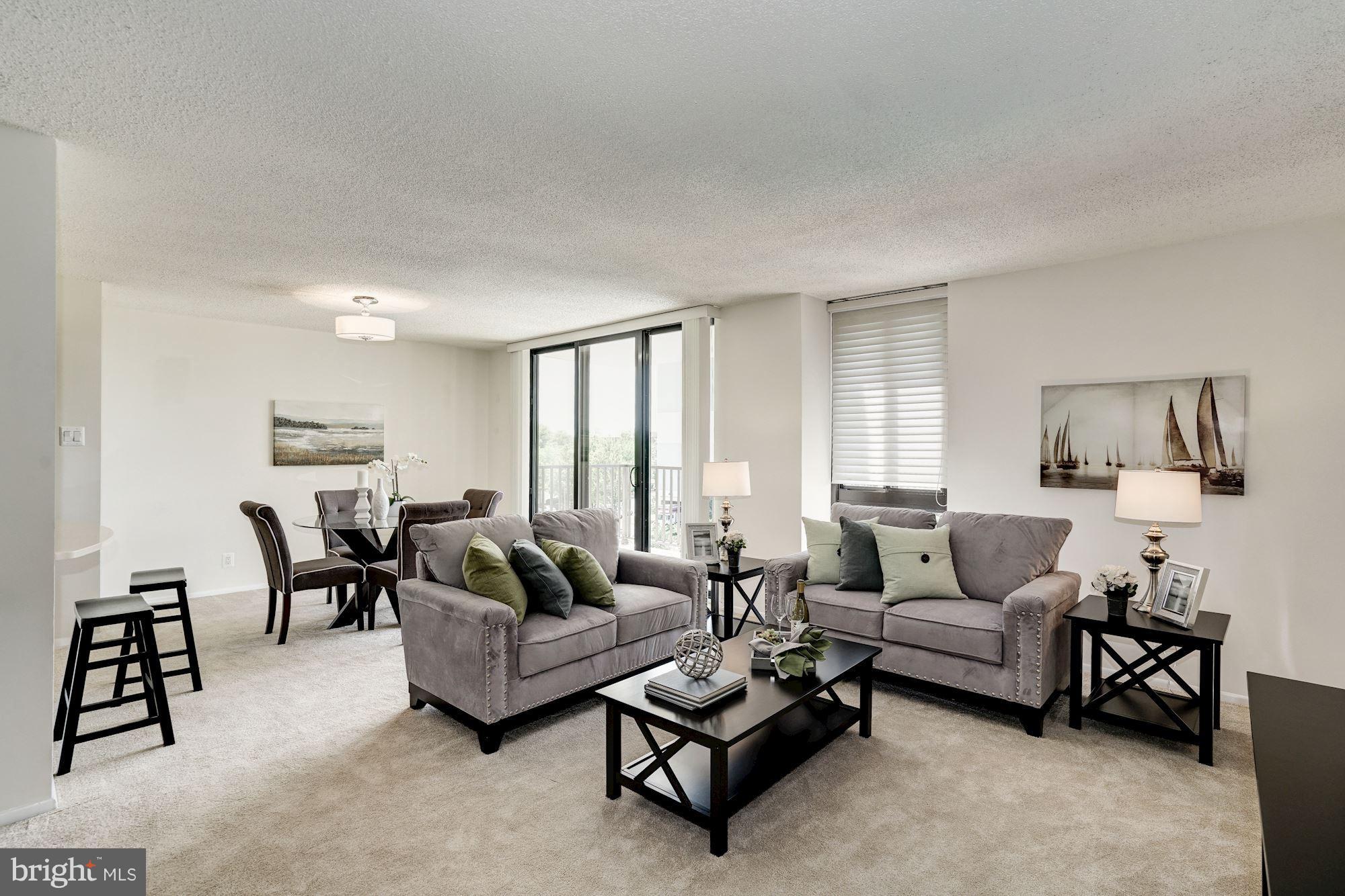 6800 Fleetwood Road, Unit 610 McLean, VA 22101 - Photo 11 of 26 a living room with furniture and a large window