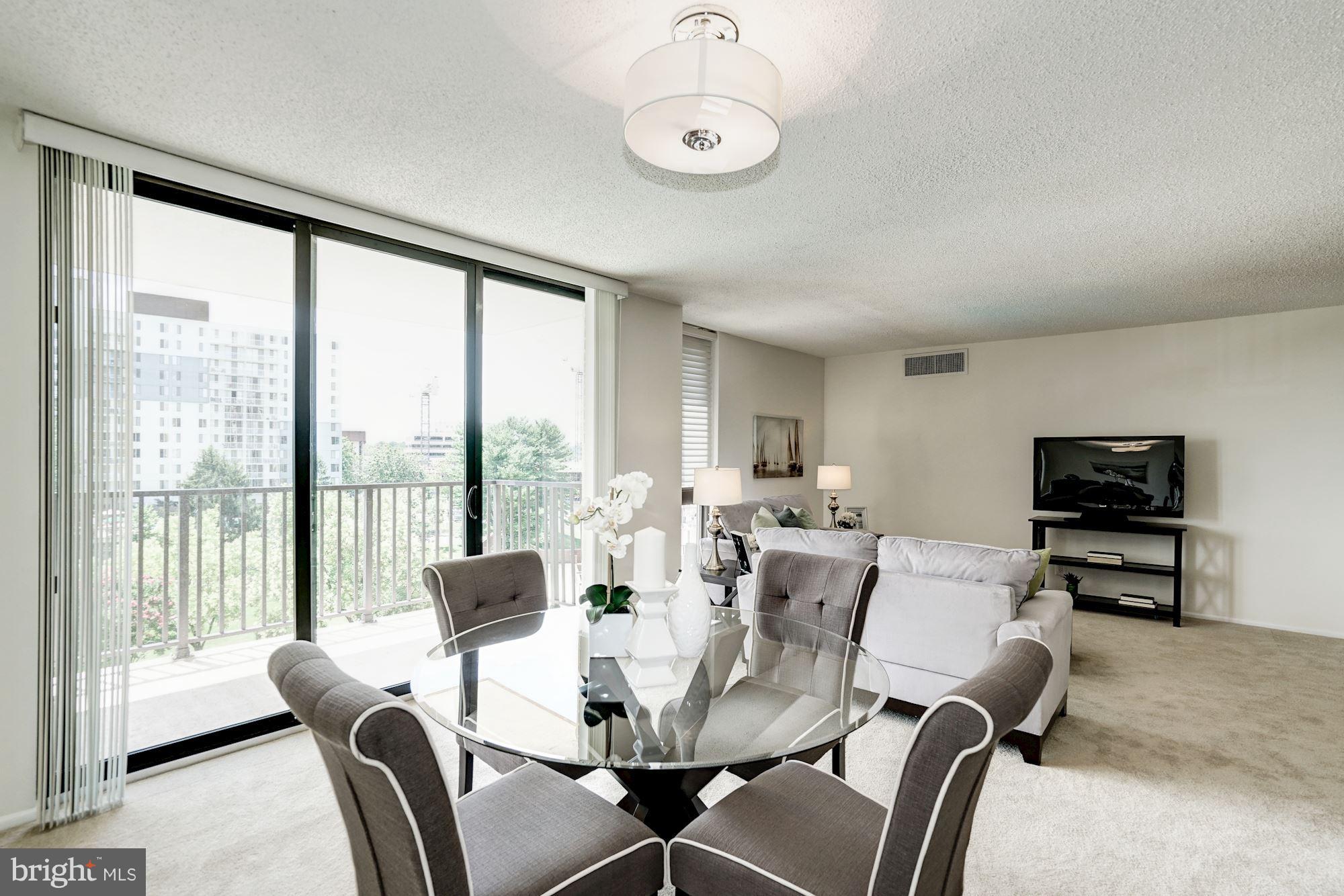 6800 Fleetwood Road, Unit 610 McLean, VA 22101 - Photo 9 of 26 a view of a dining room with furniture window and outside view