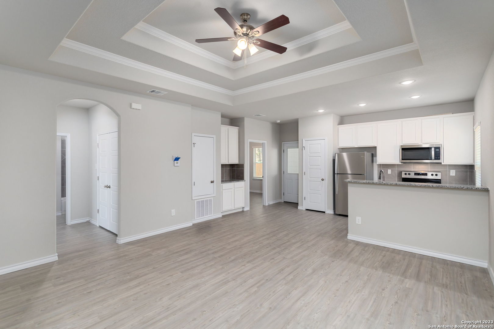 402 Trefger Street Seguin, TX 78155 - Photo 4 of 10 a view of kitchen with stainless steel appliances refrigerator stove microwave and cabinets