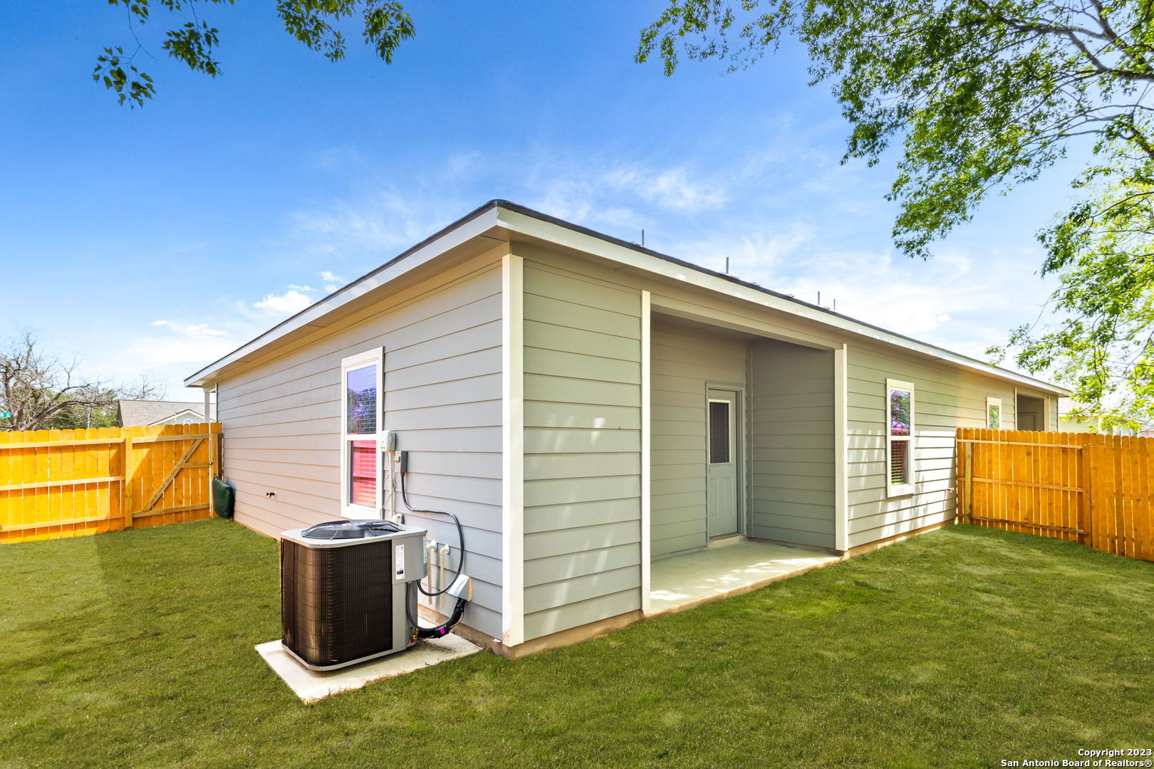 402 Trefger Street Seguin, TX 78155 - Photo 5 of 10 a backyard of a house with barbeque oven and outdoor seating
