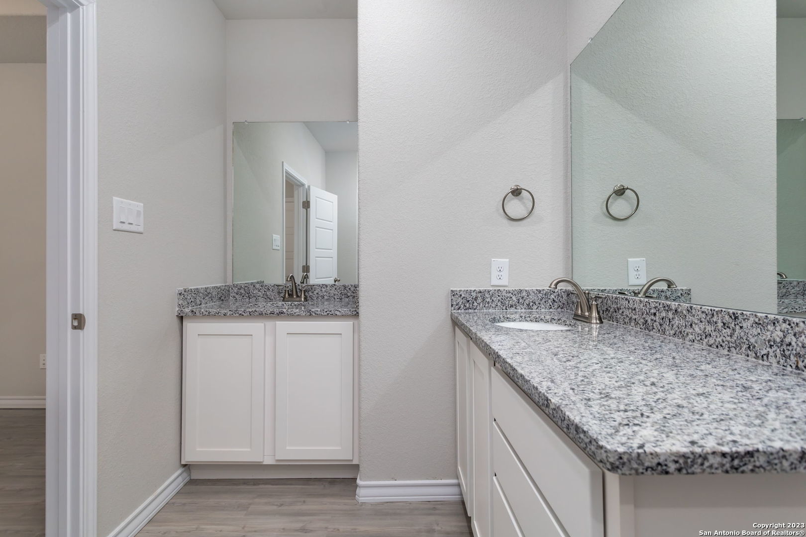 402 Trefger Street Seguin, TX 78155 - Photo 10 of 10 a bathroom with a granite countertop sink and a mirror