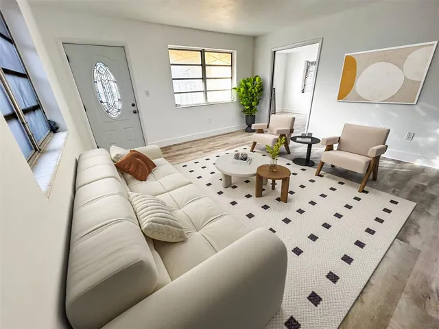 a bedroom with furniture and a window