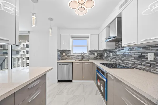 a kitchen with a sink stove and cabinets
