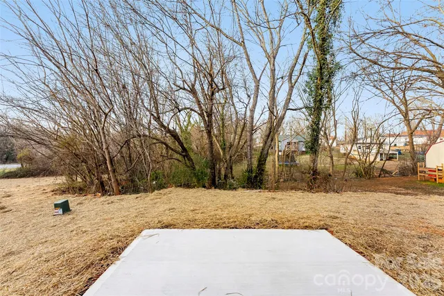 a view of a yard covered with snow