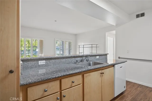 a kitchen with a refrigerator sink and stove