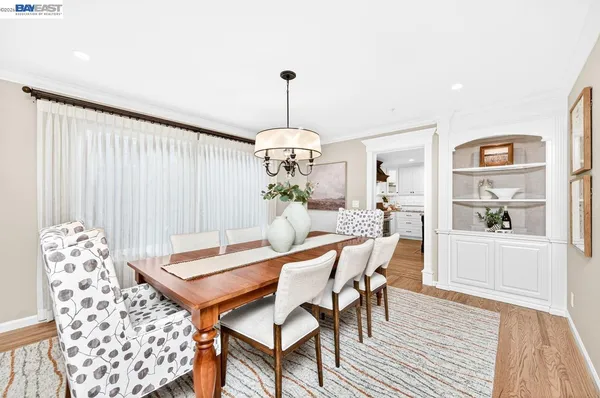 a kitchen with a sink and a stove top oven