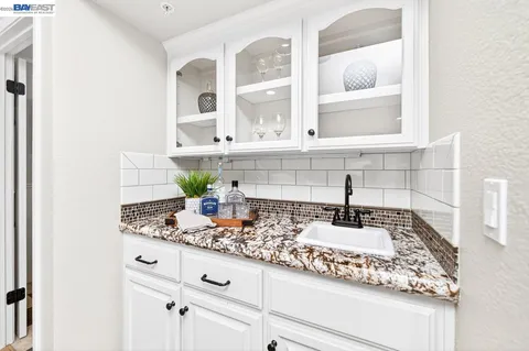 a kitchen with sink and window