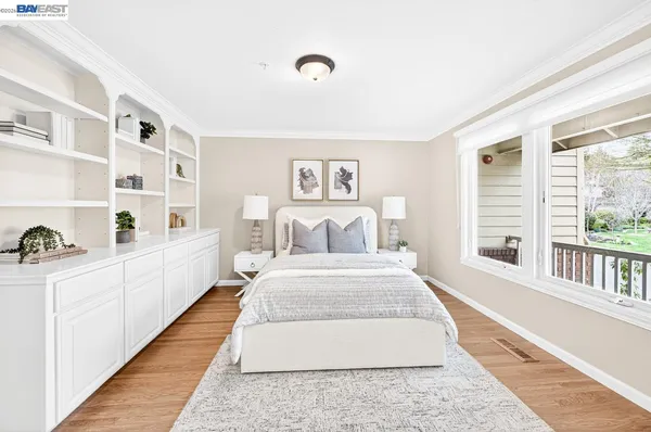 a spacious bathroom with a granite countertop double vanity sink a mirror and a shower