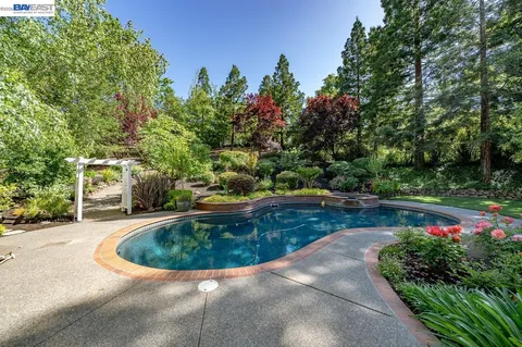 a front view of a house with swimming pool