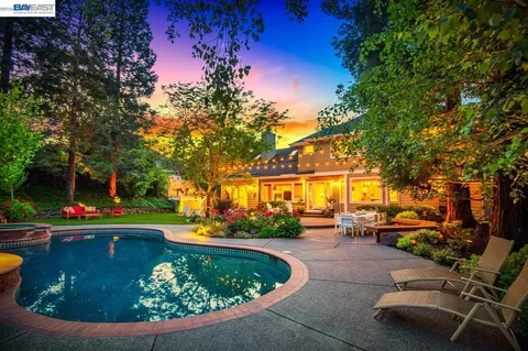 a view of a swimming pool with a patio