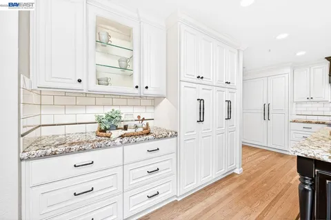 a kitchen with a cabinets and appliances