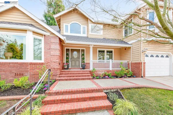 a view of a livingroom with furniture and hardwood floor