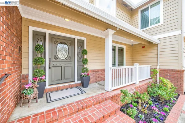a kitchen with stainless steel appliances a kitchen island hardwood floor sink stove dining table and chairs