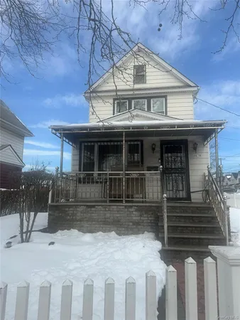 a front view of a house with a porch