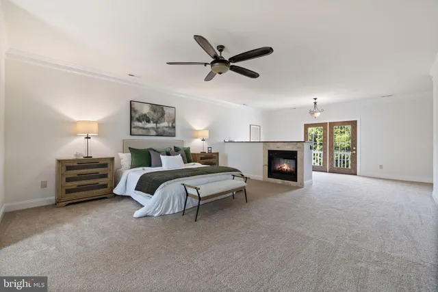 an empty room with fan and windows