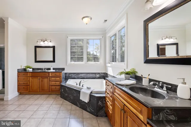 a view of a livingroom with a ceiling fan and window
