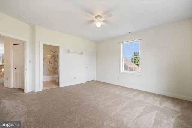 a view of an entryway with wooden floor and windows