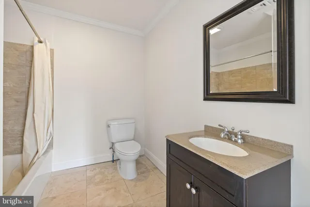 a view of a swimming pool with a table and chairs under an umbrella
