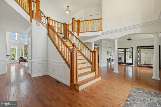 a kitchen with granite countertop a sink a counter top space appliances and cabinets