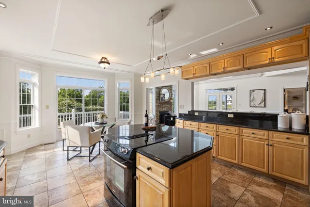 a view of a dining room with furniture wooden floor and chandelier
