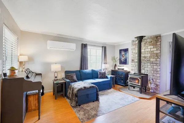a living room with furniture and a lamp