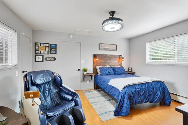 a bedroom with a bed and a chandelier