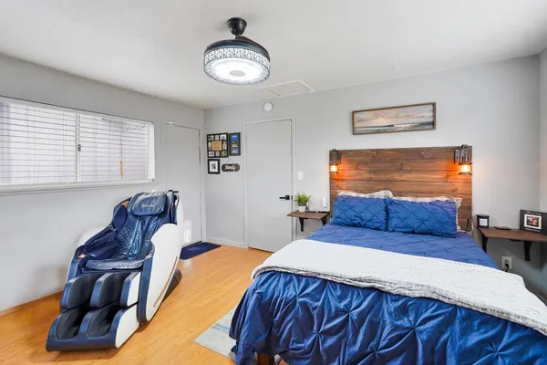 a bedroom with a bed and window