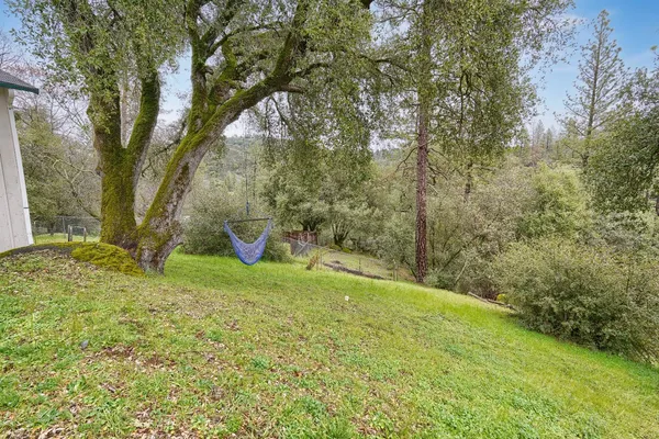 a backyard of a house with lots of green space