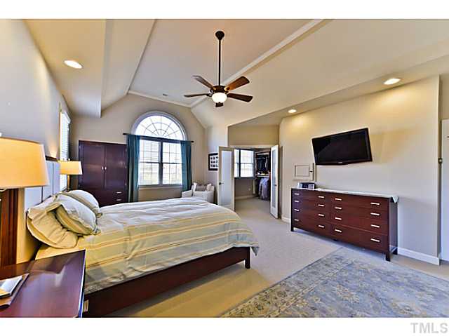 11806 Lowery Ridge Drive Raleigh, NC 27614 - Photo 12 of 25 a bedroom with a bed window and a flat screen tv