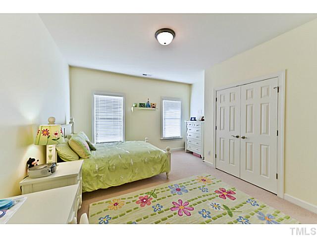 11806 Lowery Ridge Drive Raleigh, NC 27614 - Photo 16 of 25 a bedroom with a bed and a dresser