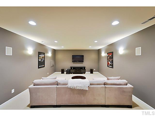 11806 Lowery Ridge Drive Raleigh, NC 27614 - Photo 20 of 25 a living room with furniture and a flat screen tv