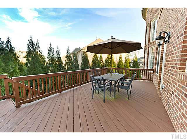 11806 Lowery Ridge Drive Raleigh, NC 27614 - Photo 22 of 25 a view of a roof deck with table and chairs