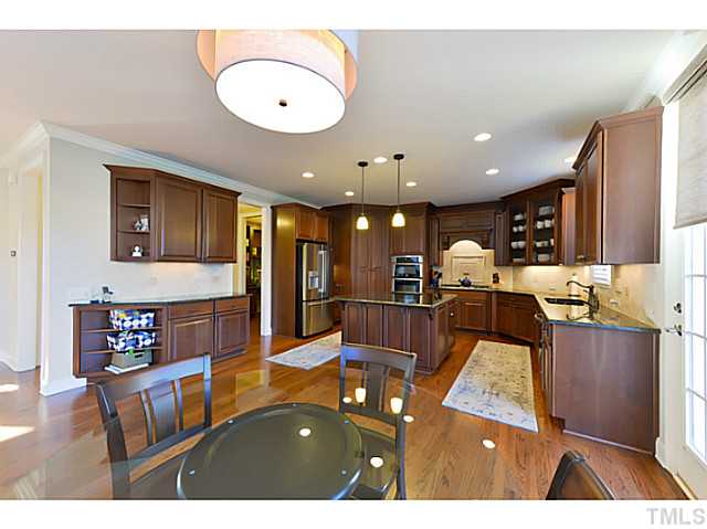 11806 Lowery Ridge Drive Raleigh, NC 27614 - Photo 5 of 25 a living room with stainless steel appliances kitchen island granite countertop furniture and a large window