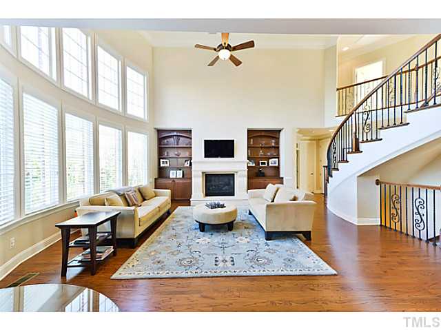11806 Lowery Ridge Drive Raleigh, NC 27614 - Photo 8 of 25 a living room with furniture fireplace and a large window