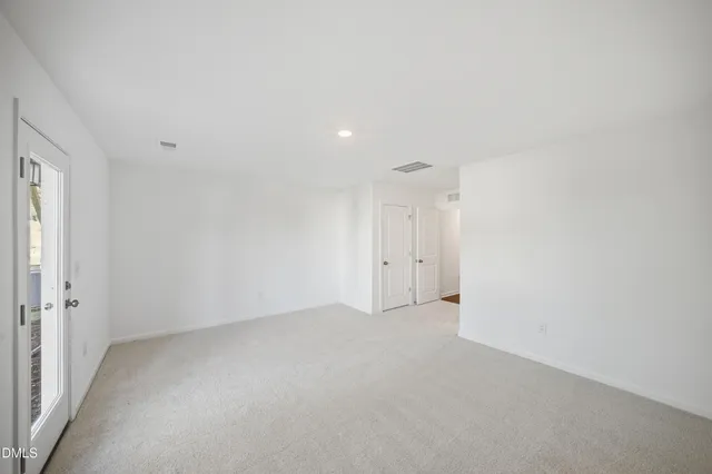 a view of a hallway with an entryway