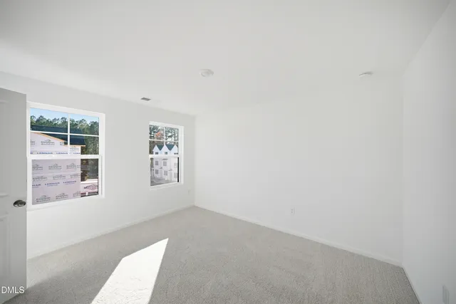 a view of a balcony with wooden fence